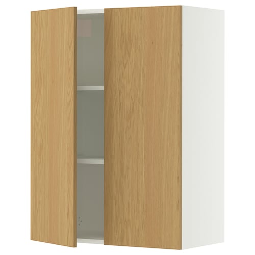 A white SEKTION wall cabinet with light oak doors and adjustable shelves, featuring a gentle door closer.