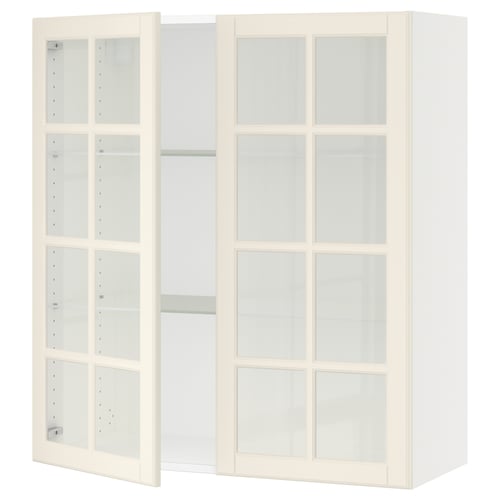 SEKTION kitchen unit with off-white glass doors and adjustable shelves.