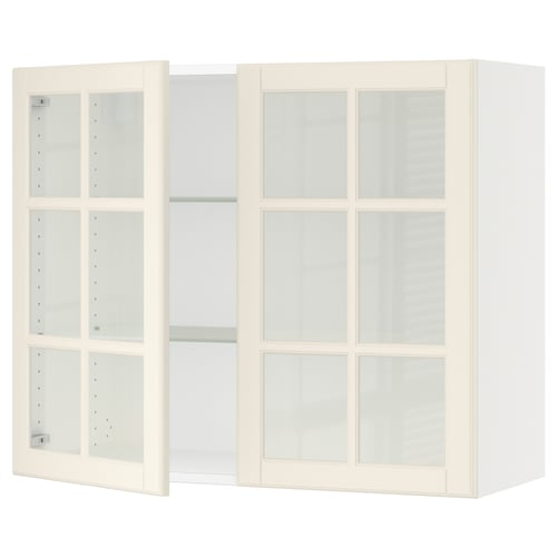 SEKTION white kitchen cabinet with frosted glass doors and adjustable shelves.
