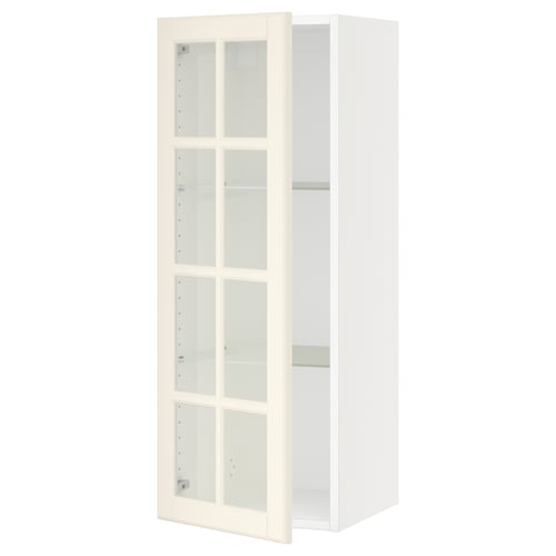 An off-white SEKTION kitchen cabinet with glass doors and adjustable shelves.