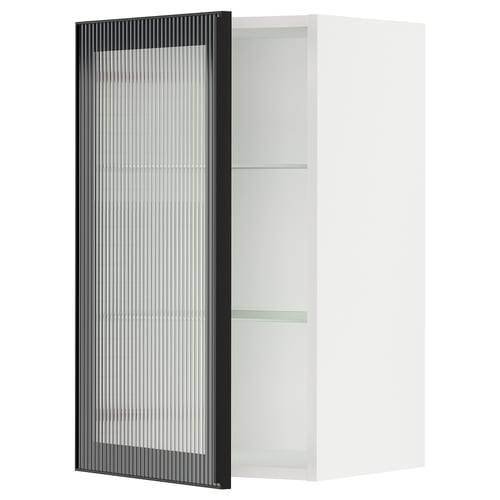 Modern kitchen cabinet with glass door, black frame, reeded glass, and sleek design.