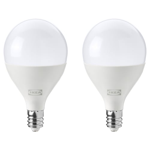Two ikea led light bulbs, white, round shape, with metallic base.