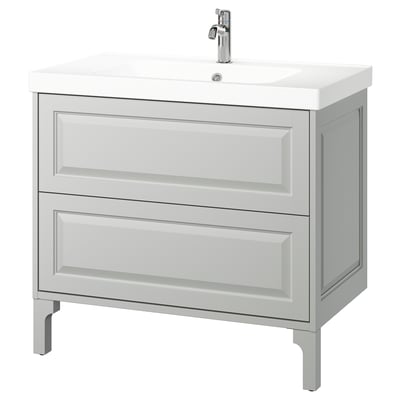 This image shows a light grey TÄNNFORSEN bathroom vanity with two spacious drawers and a ceramic sink. It bevelled edges for a classic, elegant look.