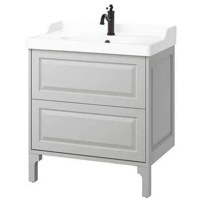 TÄNNFORSEN light grey bathroom vanity, classic design with bevelled edges, white countertop, and black tap.