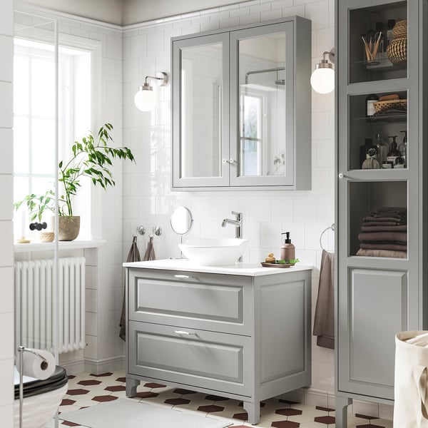 Grey TÄNNFORSEN bathroom set with sink, mirror, & storage.