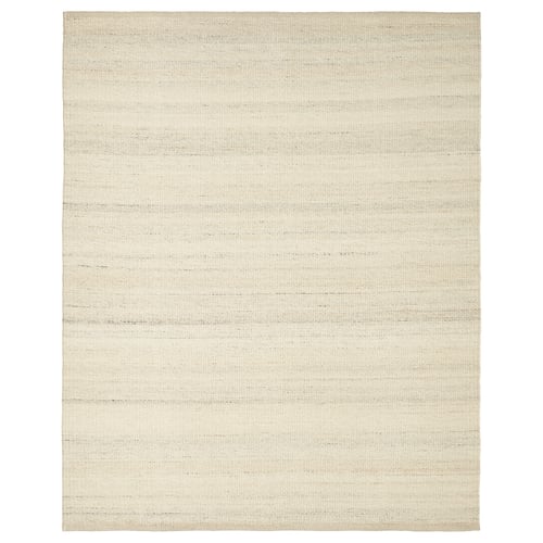 A beige, rectangular wool rug with a subtle texture.