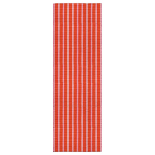 Red and white striped rectangular cotton rug.