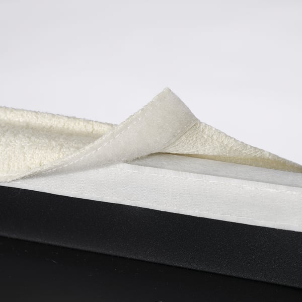 Close-up of BERGMUND chair material: soft, cushioned fabric and supportive foam padding for comfort.