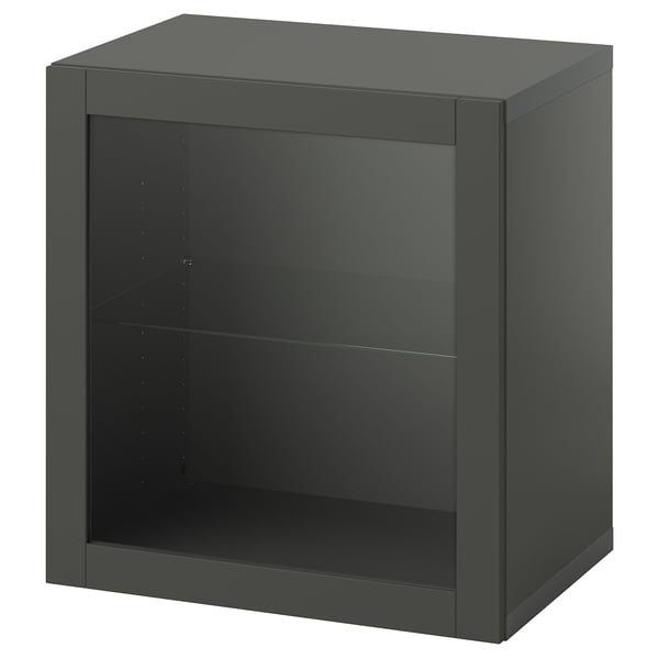 A black ikea BESTÅ storage unit with a glass shelf and glass door. The modern design is square-shaped and sleek.