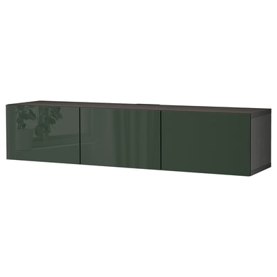A dark green BESTÅ tv bench with sleek surfaces, featuring multiple cabinets with glass-paneled doors.