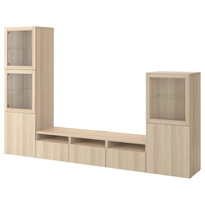 Wooden BESTÅ tv unit with drawers, shelves, and glass-door cabinets.
