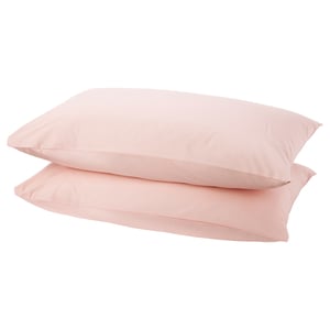Two soft pink DVALA cotton pillowcases stacked, simple, rectangular design.