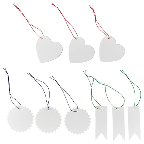 Image FÖNSTERFIKUS labels in heart, flower, and ribbon shapes. Labels are white, made of paperboard, attached with colourful elastic strings.