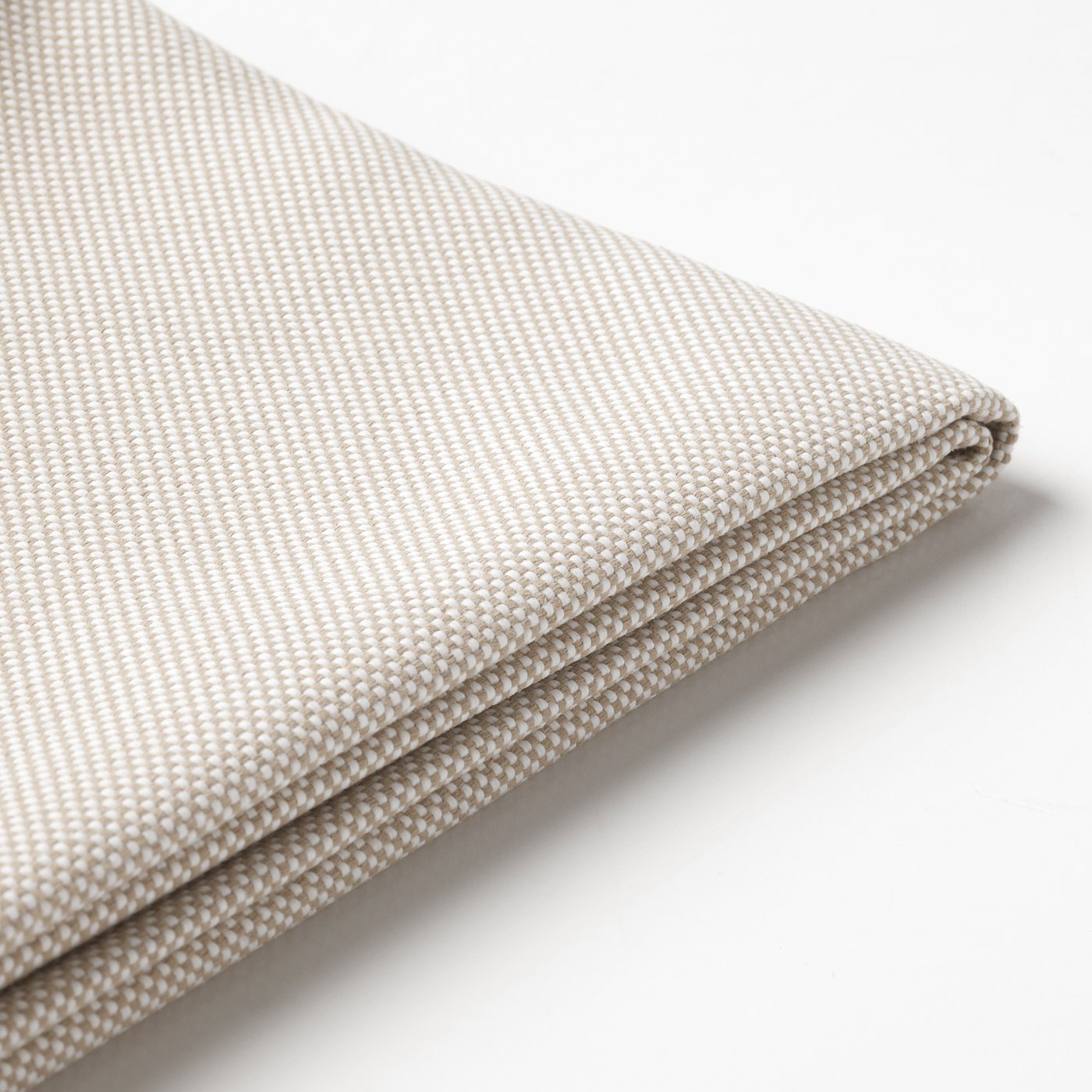 Folded beige outdoor cushion cover, texture visible, high-quality fabric.