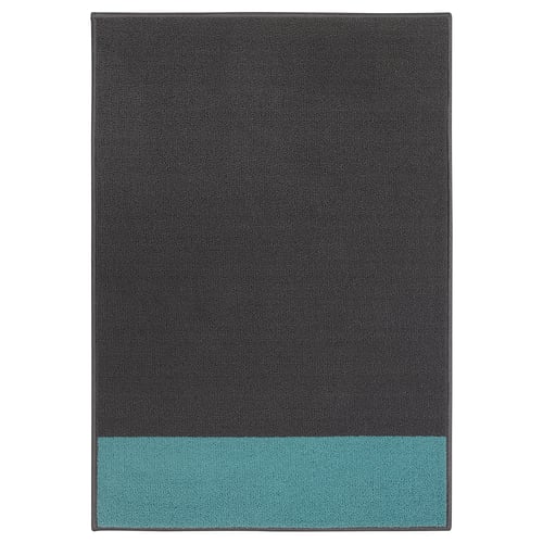 HALSTED two-tone door mat, black and turquoise. Rectangular, garlic surface, synthetic rubber backing.