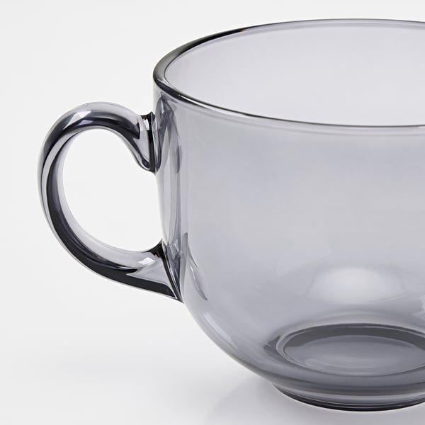 Large glass mug with sturdy handle, part of the HÖSTAGILLE collection, designed for comfort and durability.