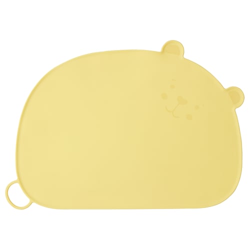 This image shows a yellow, bear-shaped silicone placemat designed for children. It rounded ears and a loop for hanging.