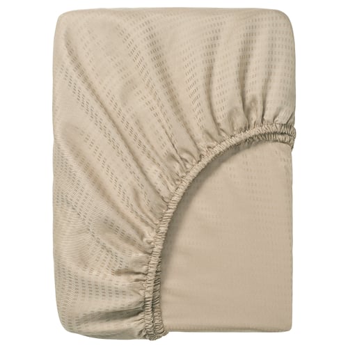 Fitted sheet named LÄKEVÄNDEROT, beige, made of 100% lyocell, rectangular with elastic corners, subtle dobby pattern.