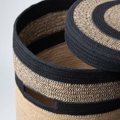 Tan jute & black cotton ikea MÄVINN storage basket, ideal for laundry or decor.