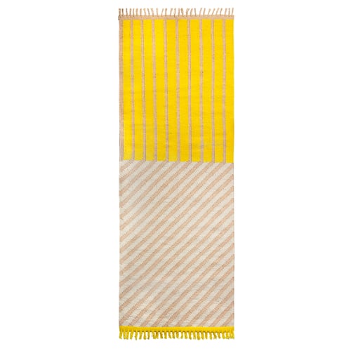 Bright yellow striped rug with fringe, woven from jute and wool in rectangular shape.