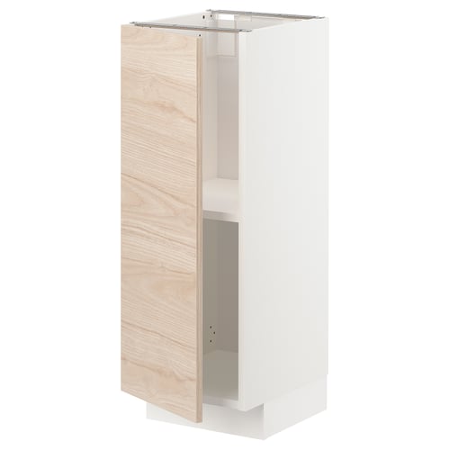 White and light ash METOD kitchen cabinet with adjustable shelves and reversible door.