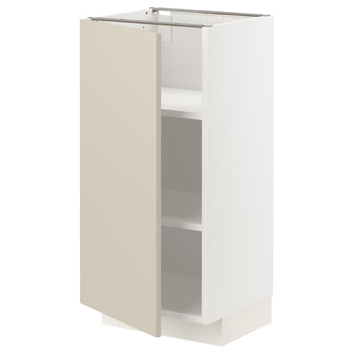 A beige and white METOD storage unit with a door and shelves inside. Its rectangular and has a modern, sleek design.