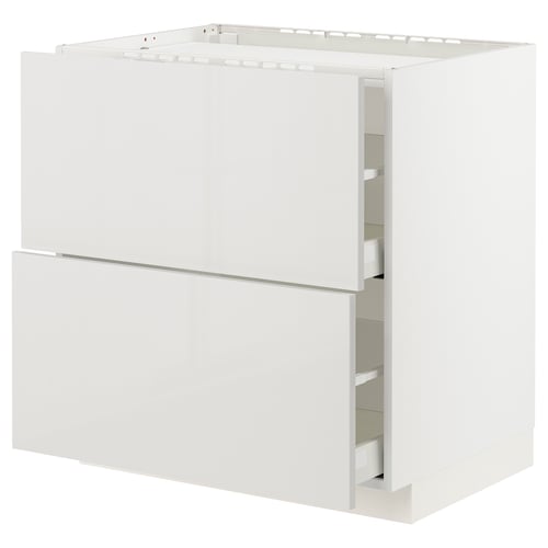 A white METOD kitchen cabinet with a modern, glossy finish and integrated drawers.