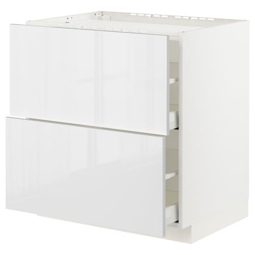 Displays a white METOD kitchen cabinet with a glossy finish, rectangular shape, and two drawers.