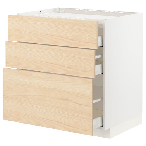 This image shows a white kitchen cabinet unit with three wooden drawers, a modern and minimalist design.