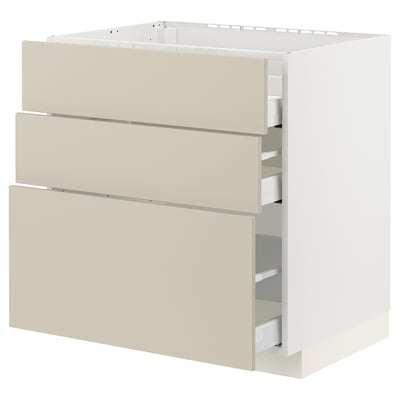Depicts a beige METOD cabinet with three drawers, made from particleboard and fiberboard, featuring a smooth, clean design.