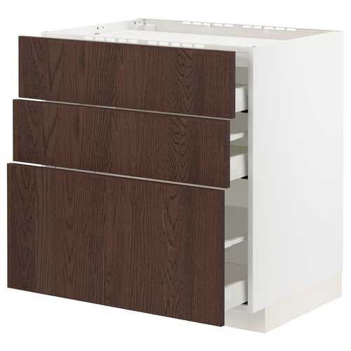 A white METOD kitchen unit with three dark brown wooden drawers. The drawers have a sleek, modern design with a sturdy construction.