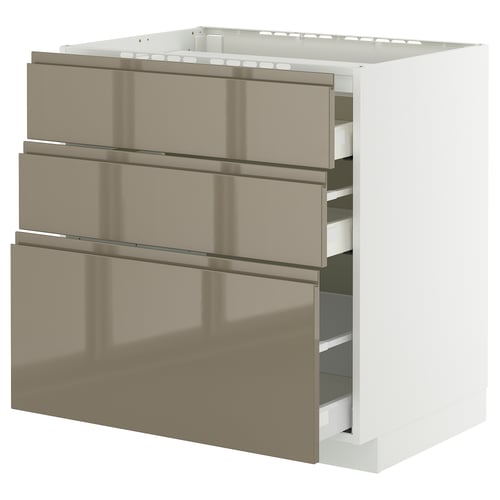 Modern kitchen cabinet, white frame with metallic bronze drawers, three drawers, sleek handles.