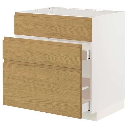 A white METOD kitchen cabinet with oak effect drawers and minimalist handles, combining warmth and modern design.