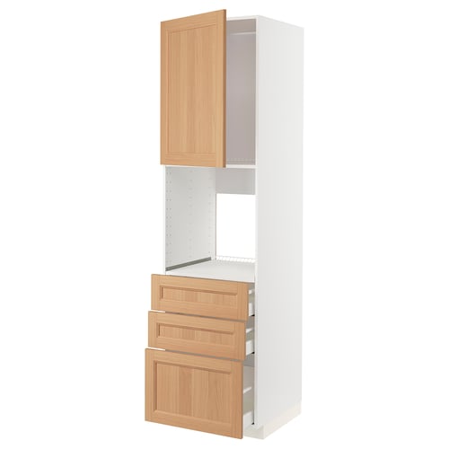 An ikea METOD kitchen unit in white with wooden drawers and doors. It a tall cabinet with drawers and shelves.