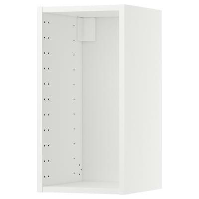 A white METOD wall cabinet from IKEA. Its rectangular with a smooth design, featuring multiple holes on one side for adjustable shelving.