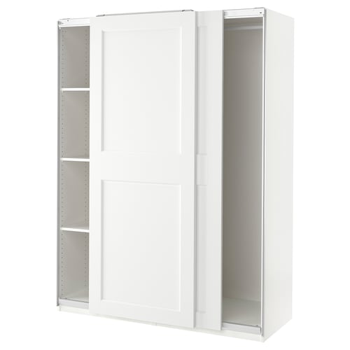 White PAX wardrobe with sliding doors and internal shelves.