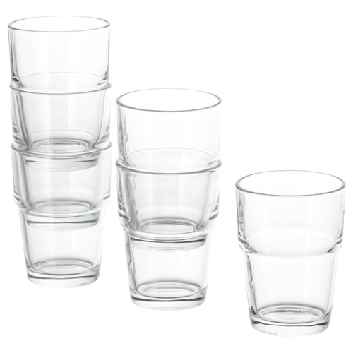 Stacks of transparent REKO glasses in various sizes, made of glass, and designed to stack neatly for space-saving.