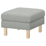 Grey upholstered footstool with wooden legs.