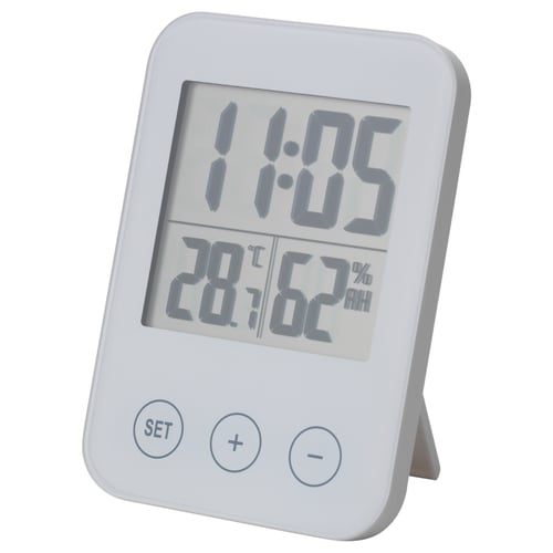 White SLÅTTIS multi-function clock, displays time, temp, humidity, standing design, abs plastic.