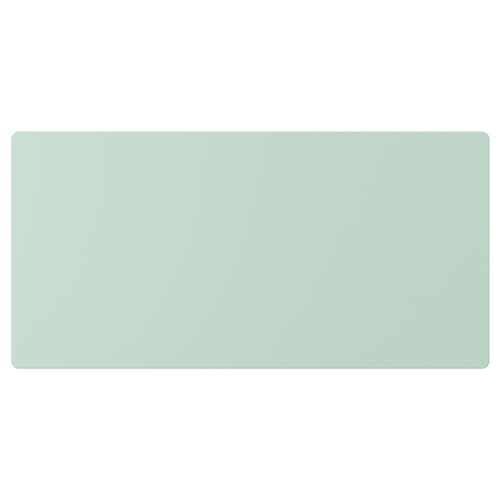 Green rectangular flat surface, likely a drawer front, smooth and plain.