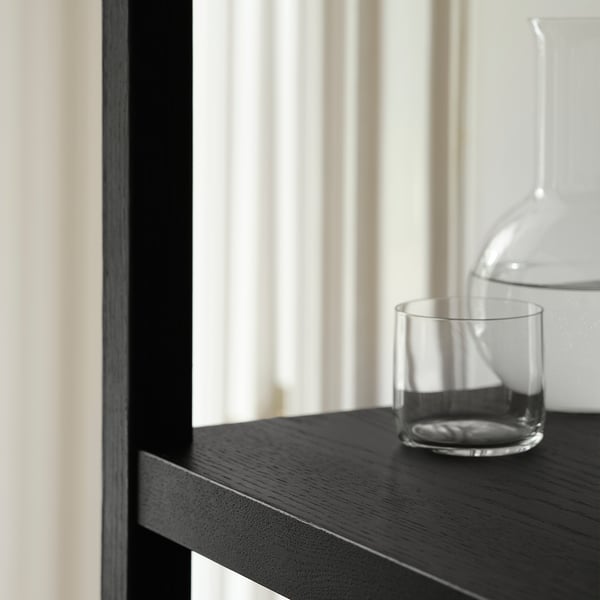 Wood shelf with jar & cup by window.
