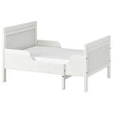 A white SUNDVIK toddler bed with extendable made from solid pine and fiberboard, designed for durability and timeless style.