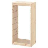An ikea TROFAST light pine wooden storage frame, rectangular, for organizing childrens items.