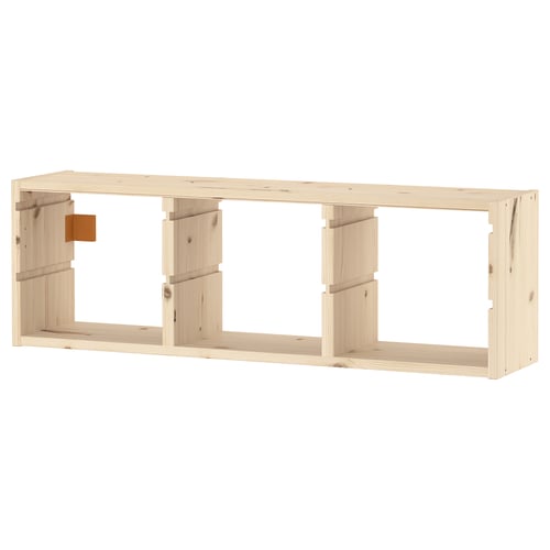 An empty TROFAST wooden shelves unit in light natural colour. It’s made of solid pine, featuring a rectangular shape with multiple open compartments.