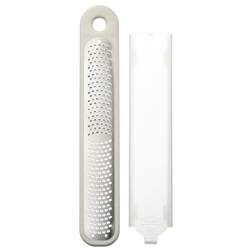 UPPFYLLD handheld grater, white, plastic protector, stainless steel grater, rectangular shape, compact design.