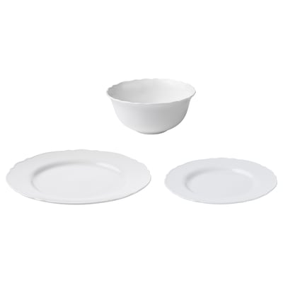 White UPPLAGA porcelain dinnerware set. Contains plates and bowls with ruffled edges. Rural, rustic design, durable and dishwasher-safe.