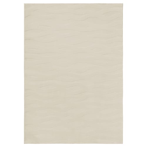 Displays a VÄXELFEL rug in beige, featuring a soft, wavy 3d pattern and recycled polyester material.