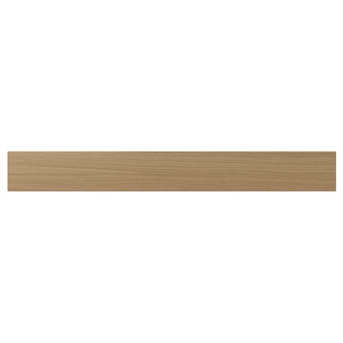 A VEDHAMN kitchen drawer front in natural wood. It is rectangular with visible oak grain, framed by solid wood, and lacquered for durability.