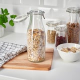 KORKEN Balang berpenutup berbentuk botol, kaca jernih, 1.4 l