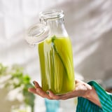 KORKEN Balang berpenutup berbentuk botol, kaca jernih, 1 l